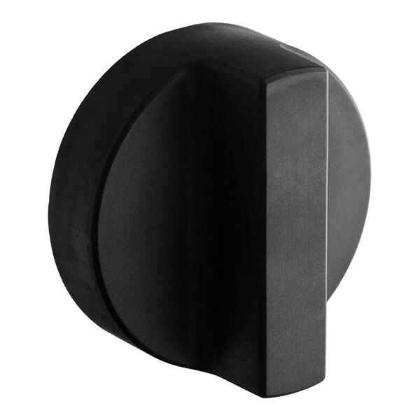 A black circular knob for a gas valve.