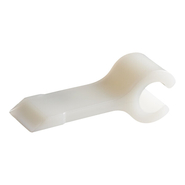 A white plastic Cleveland scraper blade clip.