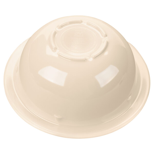 A tan melamine bowl with a round base.