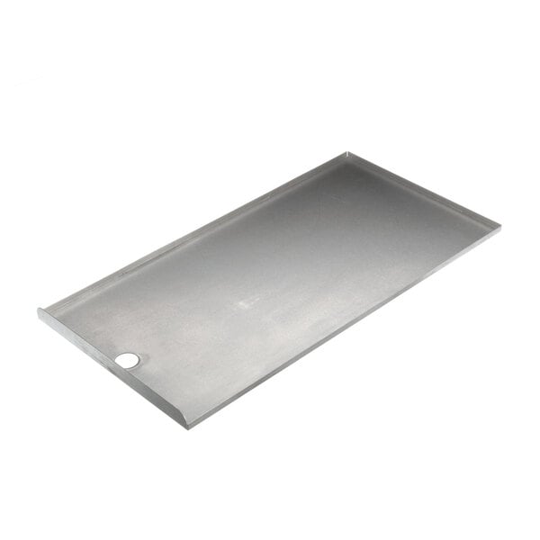 A stainless steel rectangular tray with a hole in the middle.