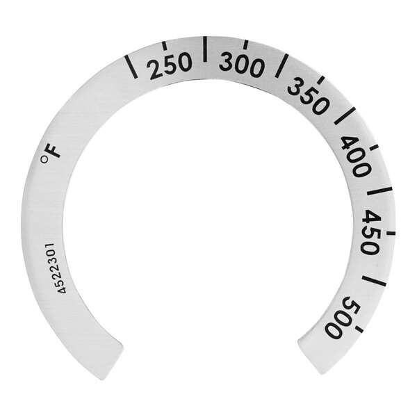 A circular metal US Range oven knob with numbers on it.