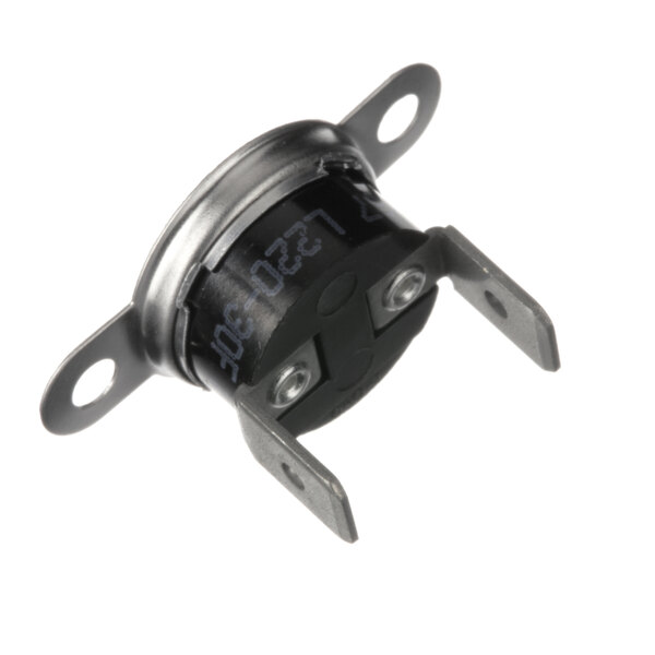 A close-up of a small metal Victory thermostat with black and silver dials.