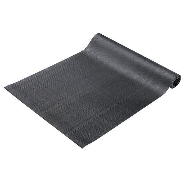 A black rubber runner mat with a curved edge rolled up.