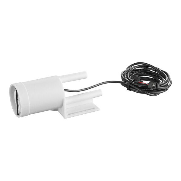 A white plastic tube with wires and a white device.