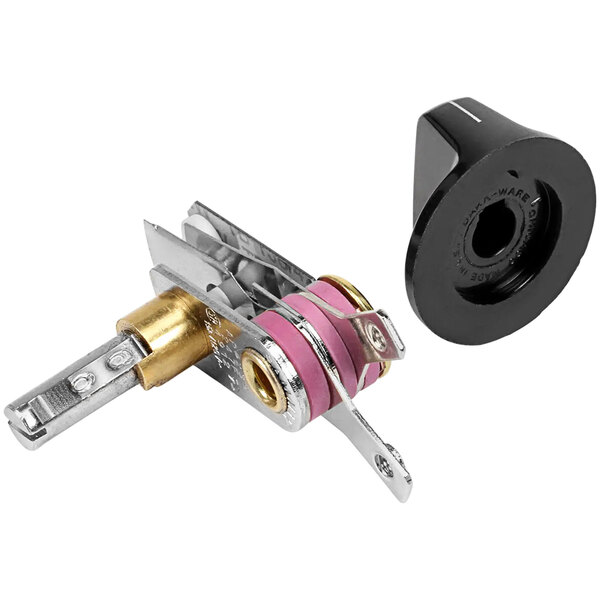 A close-up of an APW Wyott metal and black knob with a pink indicator.