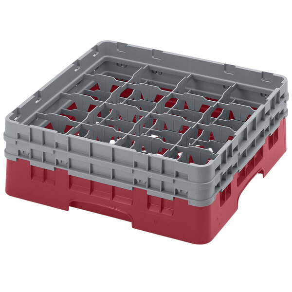 A red and gray plastic Cambro glass rack with 16 compartments and 2 extenders.