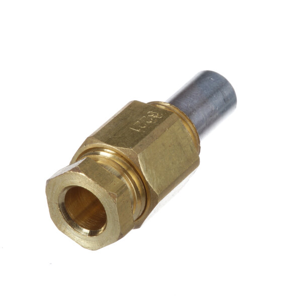 A close-up of a brass and gold threaded connector on a Jade Range.