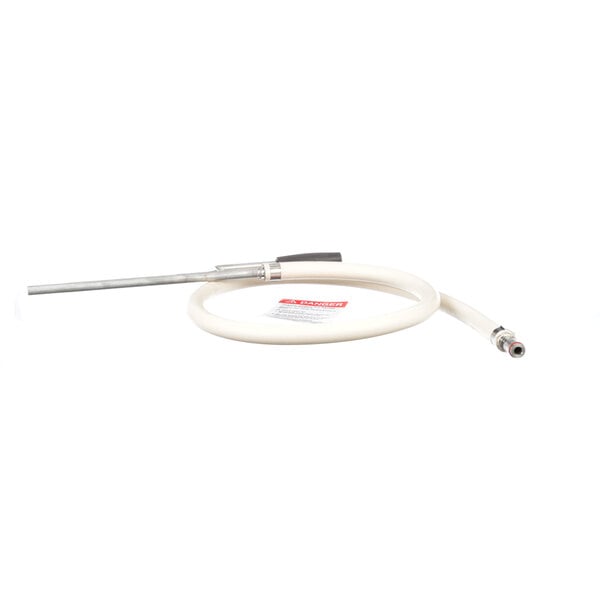A white hose with a red label and black handle.
