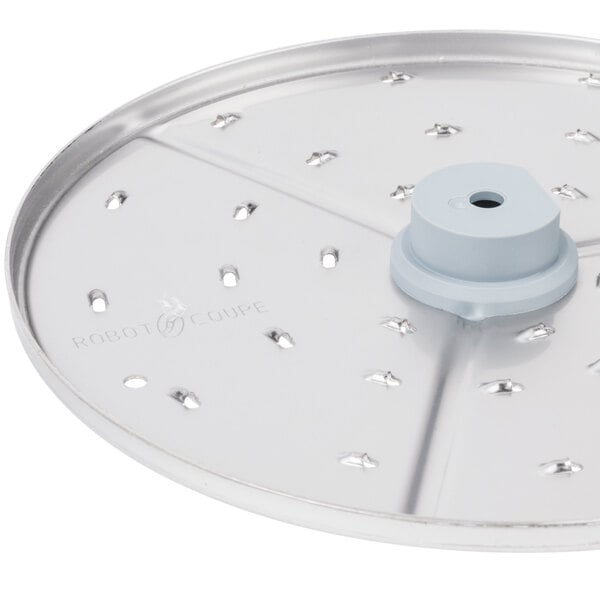 A silver Robot Coupe 1/16" grating / shredding disc with holes.