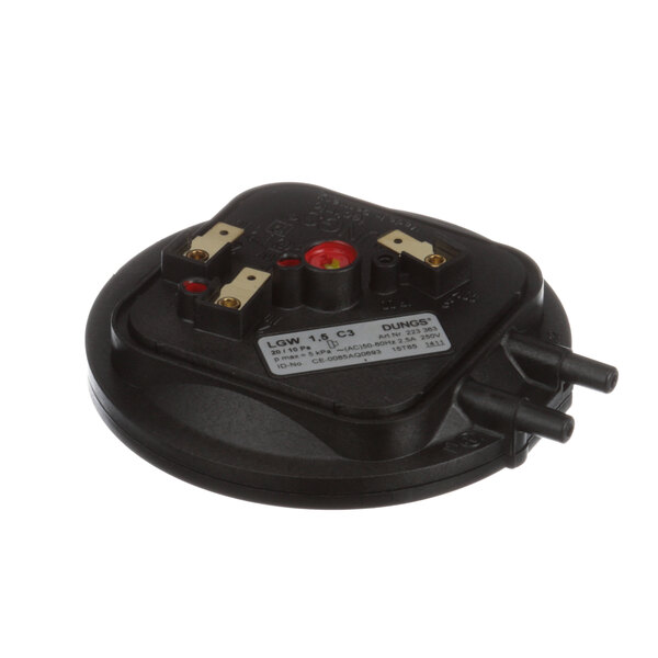 A black Blodgett pressure switch with a red button.