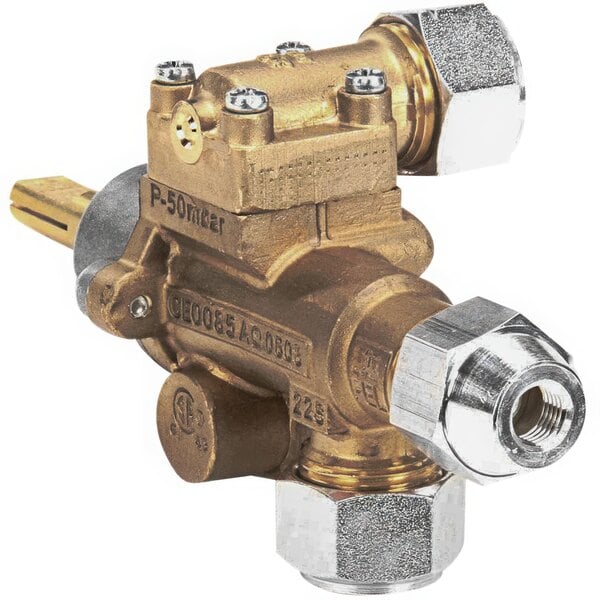 A close-up of a gold and silver valve with two brass valves.