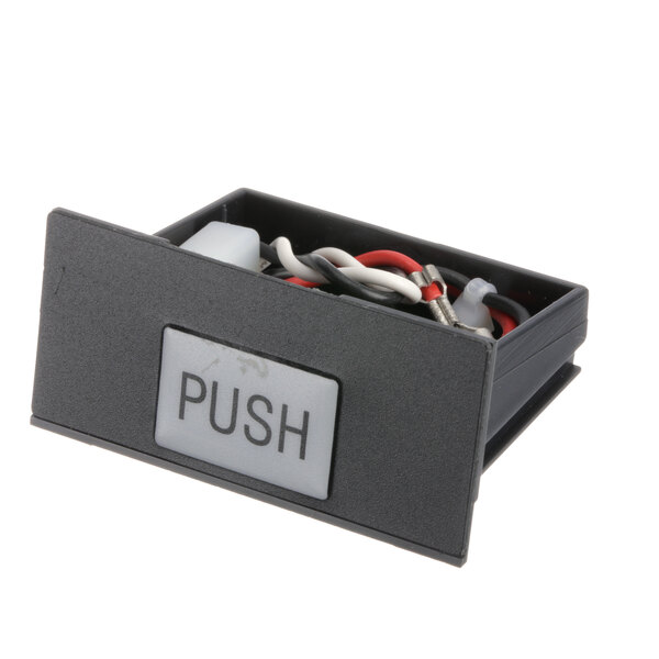 A black Cornelius 2325 module with wires inside.