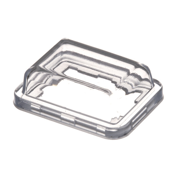 A clear plastic protection cap with a small hole in it.