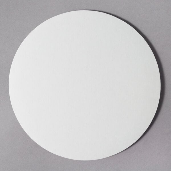 An 8" white corrugated cake circle.