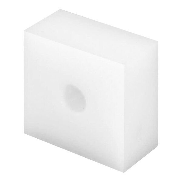 A white cube with a hole in it.