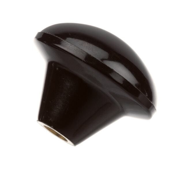 A black plastic Grindmaster-Cecilware knob with a hole in it.