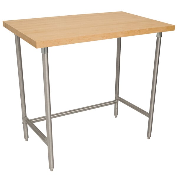 An Advance Tabco wood top work table with a stainless steel base.