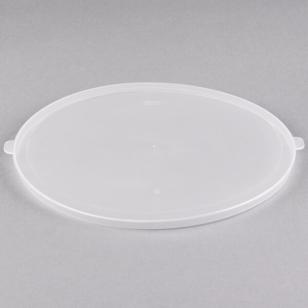 A white plastic lid on a clear plastic bowl.