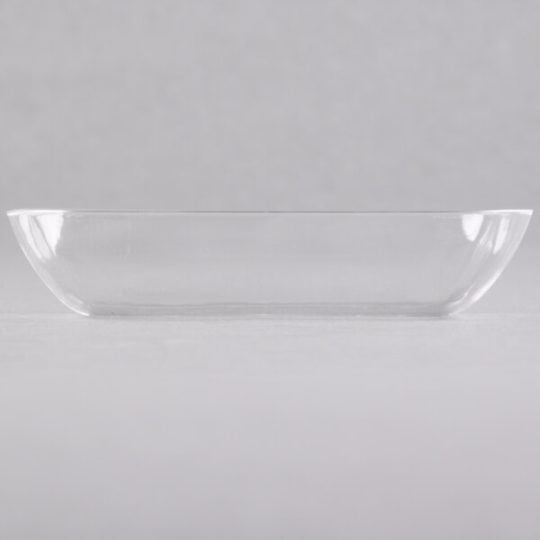 A clear plastic rectangular Fineline Tiny Temptations tray on a white surface.