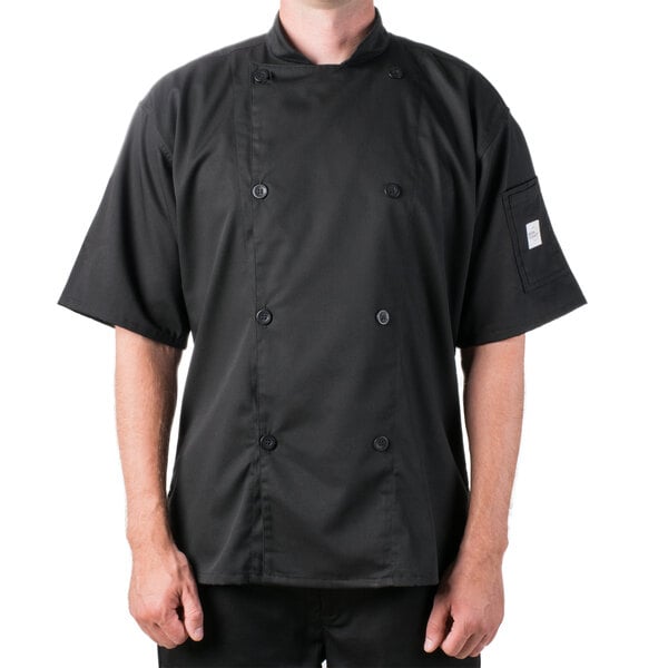 A man wearing a black Mercer Culinary chef coat.