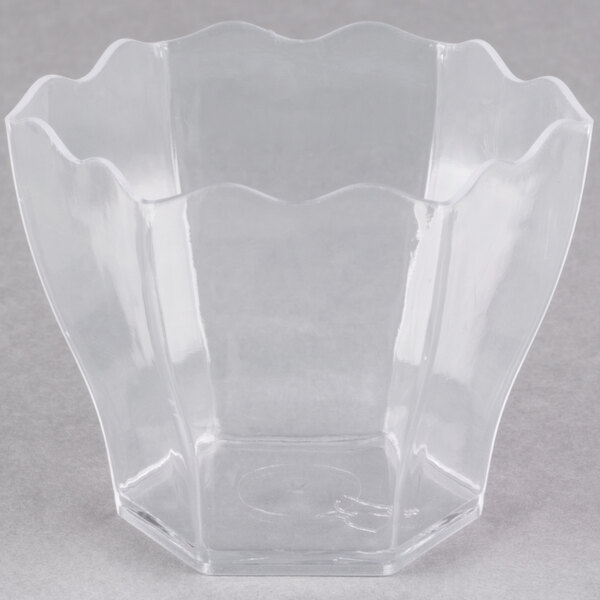 A clear plastic hexagon cube bowl.