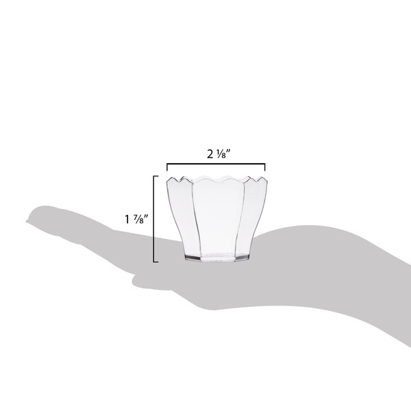 A hand holding a clear plastic hexagon cube bowl.