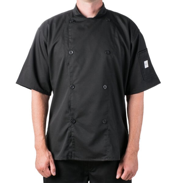 A man wearing a black Mercer Culinary chef jacket.