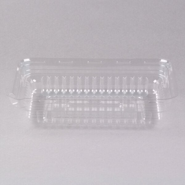 A clear plastic serving tray dome lid on a white surface.