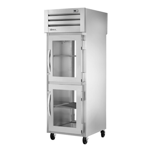 A stainless steel True pass-through refrigerator with glass doors.