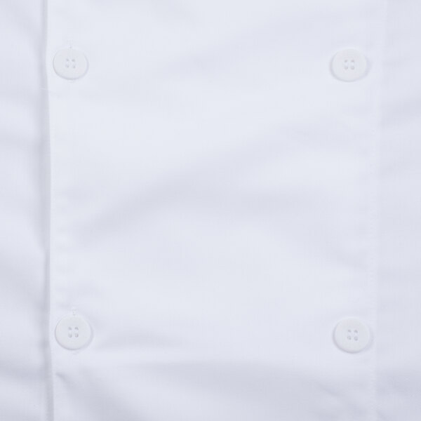 A close up of a white Mercer Culinary chef jacket with a white button with four holes.