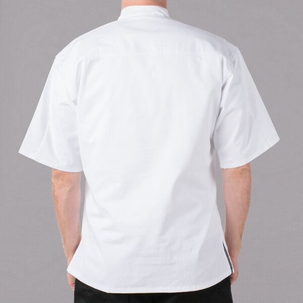 A man wearing a white Mercer Culinary chef jacket.