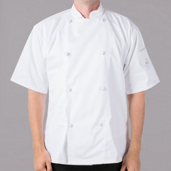 A man wearing a white Mercer Culinary chef's coat.