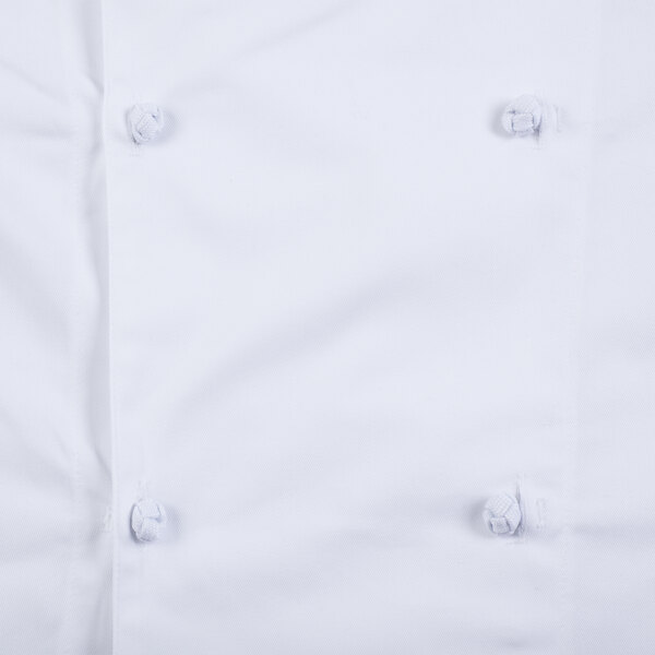 A close up of a white Mercer Culinary chef jacket.