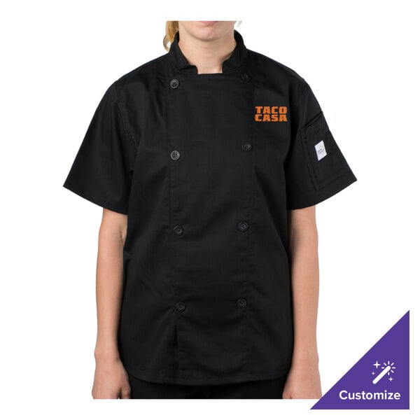 A person wearing a black Mercer Culinary chef jacket.