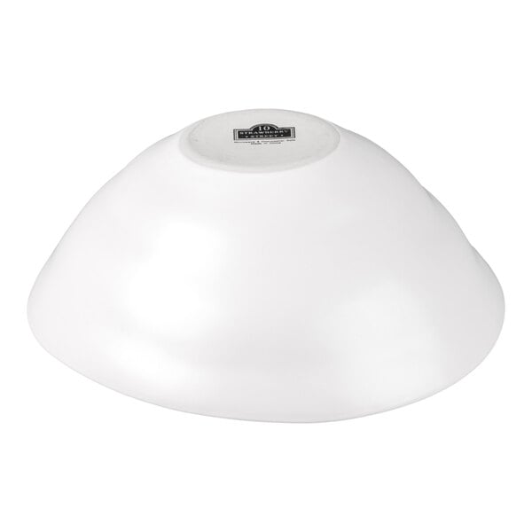 A large white stoneware serving bowl with a matte finish, shown upside down.