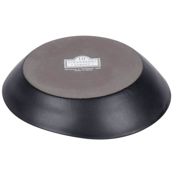 A black and grey 10 Strawberry Street stoneware bowl with a matte wave design.