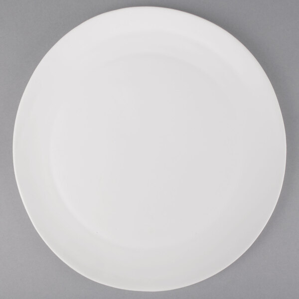 A 10 Strawberry Street white stoneware charger plate with a round rim.