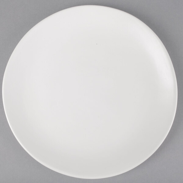 A white 10 Strawberry Street stoneware plate with a round rim.