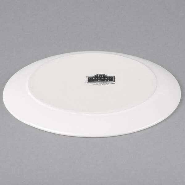A white 10 Strawberry Street stoneware plate with a logo on it.