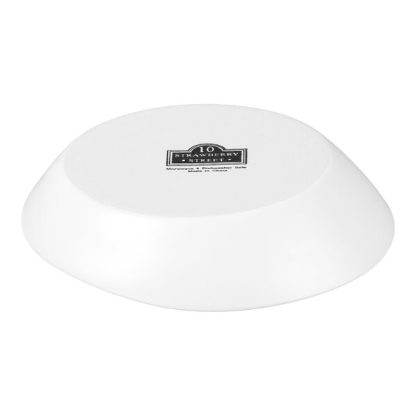 A white stoneware soup bowl shown upside down.