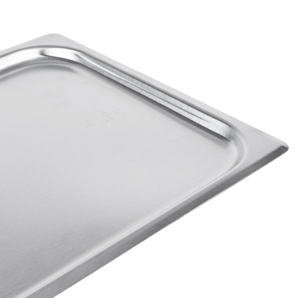 A Vollrath stainless steel 1/2 size steam table pan with lid.