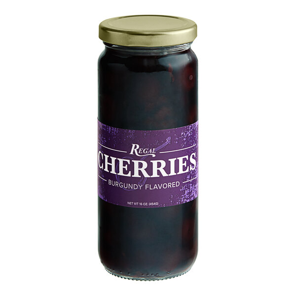 A jar of Regal Purple Maraschino Cherries with Stems on a white background.