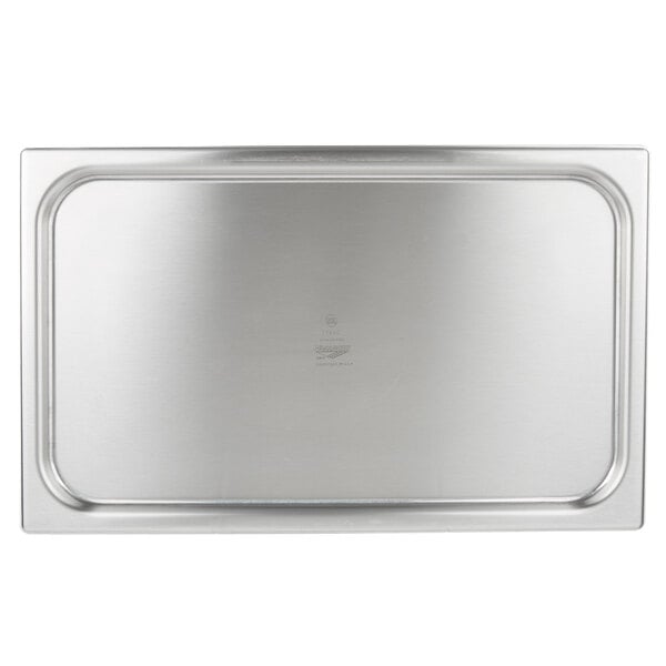 A Vollrath stainless steel rectangular pan cover on a stainless steel tray.