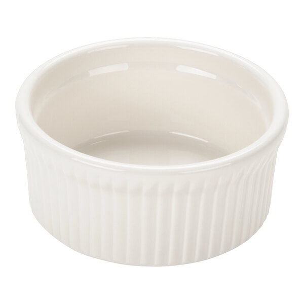 A white fluted china ramekin with a 10 oz. capacity.