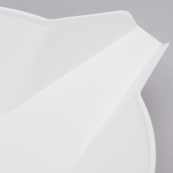 A white bowl with a curved edge and a pointed tip.