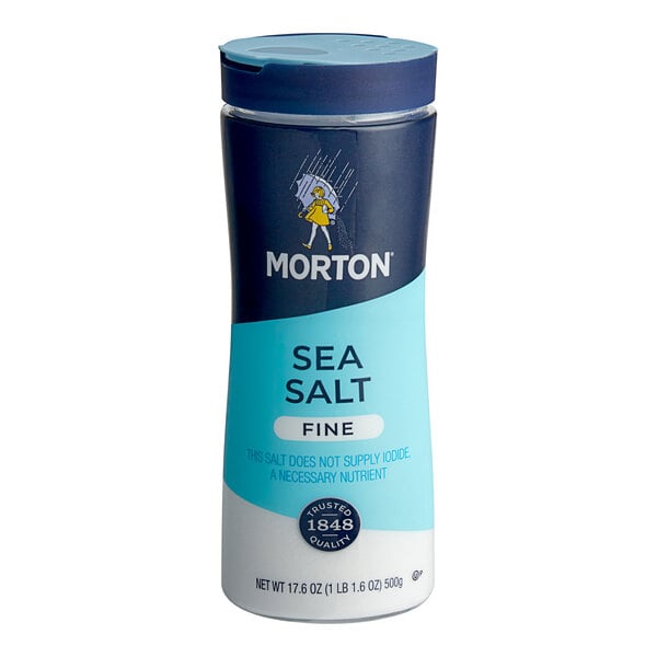A close up of a Morton Fine Sea Salt bottle with a blue lid.