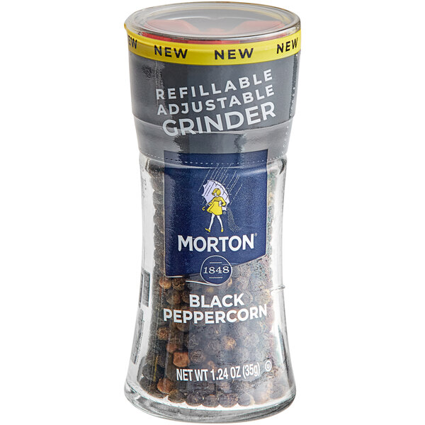 A Morton glass jar of black peppercorns with a black label and grinder lid.