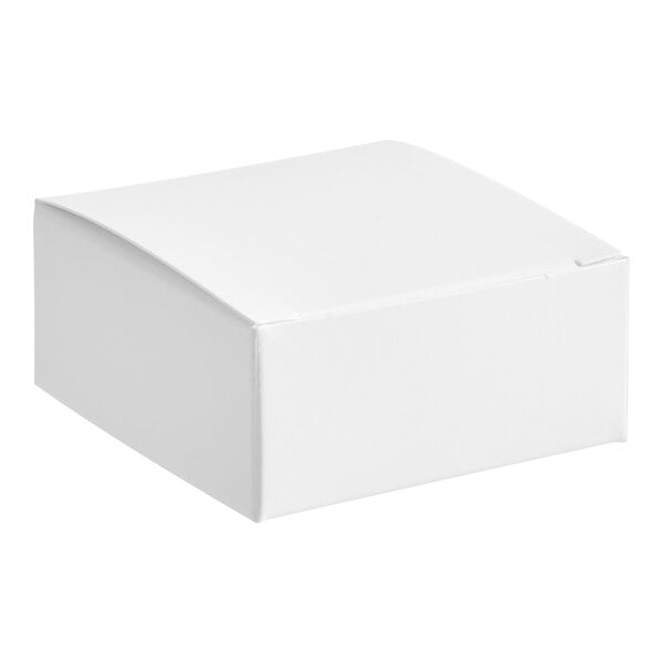 A 2 1/2" x 2 1/2" white candy box with a lid.
