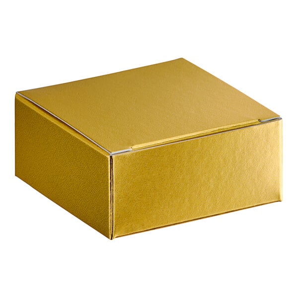 A gold square candy box with a white lid.