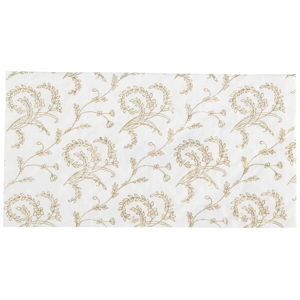 A white rectangular pad with gold floral design.